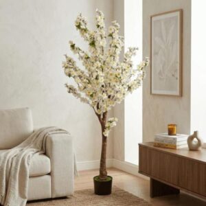 Árbol artificial de flor blanca tipo durazno en maceta negra