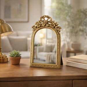 Espejo de mesa arqueado dorado con moño
